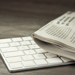 Picture of a keyboard and newspaper.